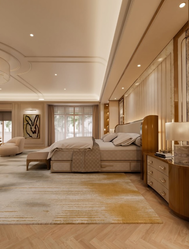 La suite principal mantiene una estética cálida y serena, con materiales nobles, iluminación indirecta y amplios ventanales hacia el exterior.